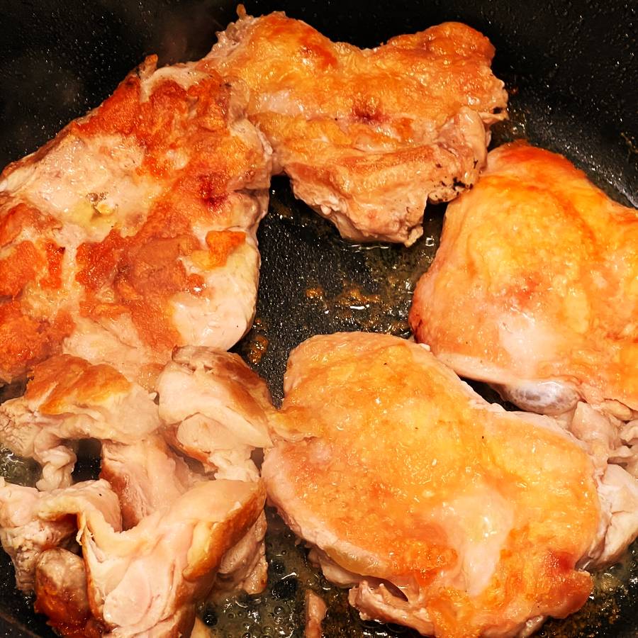 pan seared boneless chicken thighs skin side down crispy in skillet
